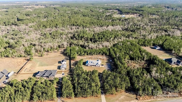 birds eye view of property with a wooded view