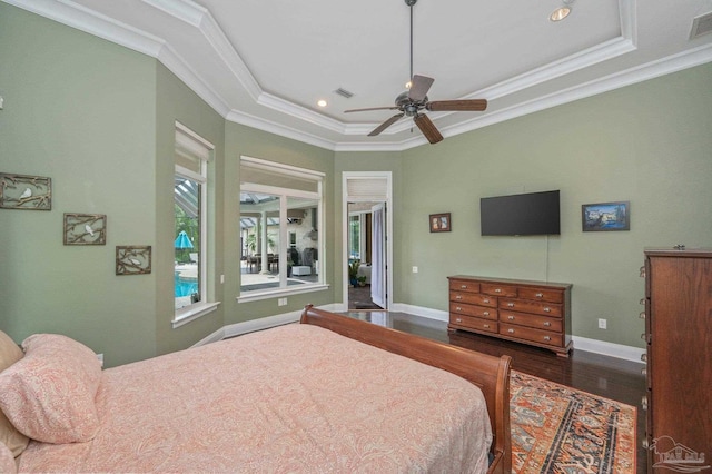 337 Grande Oaks Blvd, Cantonment, FL 32533 - bedroom featuring wood finished floors, a raised ceiling, crown molding, recessed lighting, and baseboards