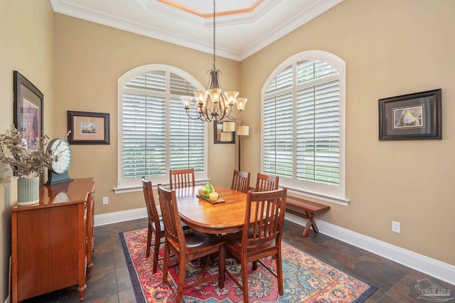337 Grande Oaks Blvd, Cantonment, FL 32533 - dining area featuring a chandelier, crown molding, and baseboards