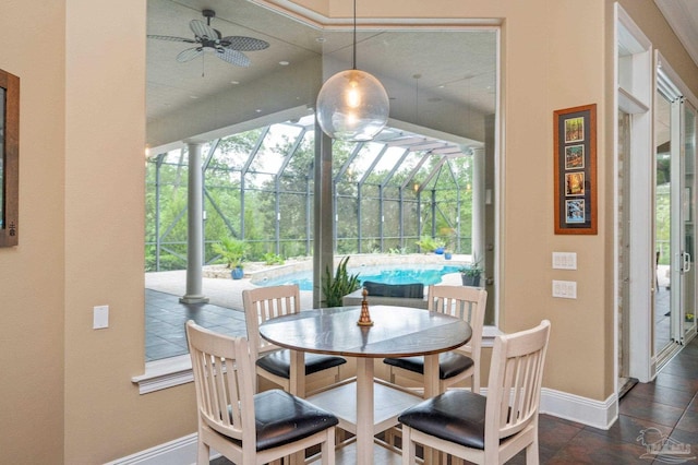 337 Grande Oaks Blvd, Cantonment, FL 32533 - dining room featuring ceiling fan, baseboards, and a sunroom