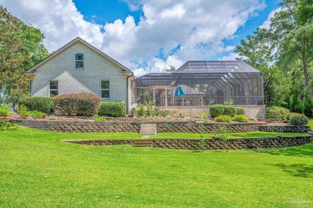 337 Grande Oaks Blvd, Cantonment, FL 32533 - back of house with a lawn and glass enclosure