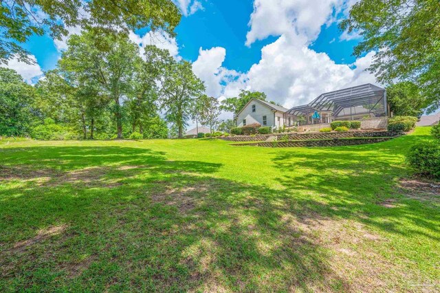 337 Grande Oaks Blvd, Cantonment, FL 32533 - view of grassy yard with a lanai