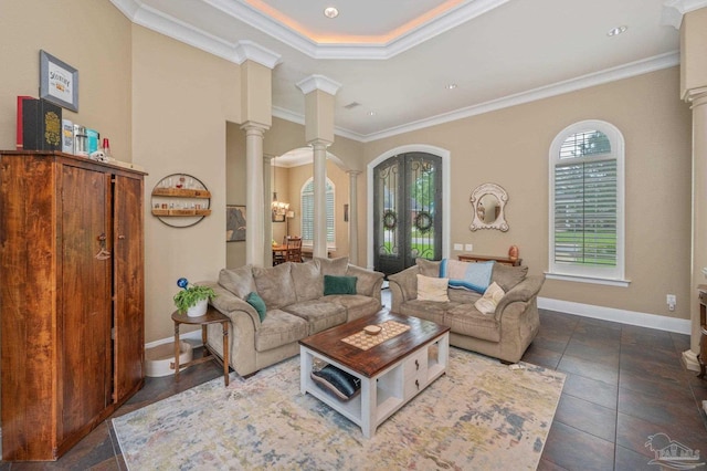 337 Grande Oaks Blvd, Cantonment, FL 32533 - living room with crown molding, baseboards, decorative columns, and french doors