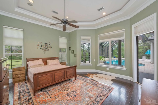 337 Grande Oaks Blvd, Cantonment, FL 32533 - bedroom featuring a raised ceiling, access to outside, ornamental molding, wood finished floors, and multiple windows