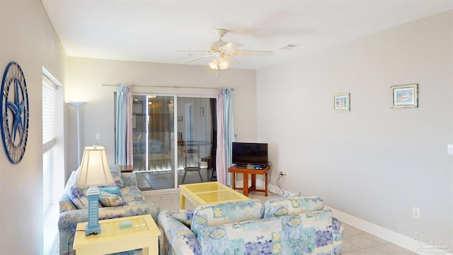 tiled living room with ceiling fan