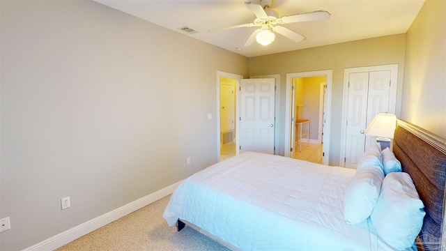 carpeted bedroom featuring a closet and ceiling fan