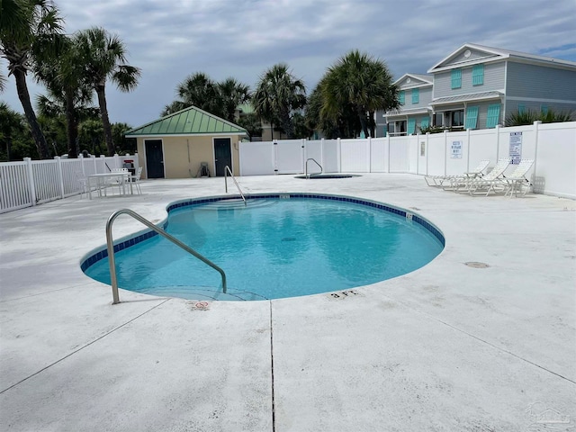 view of pool featuring a patio