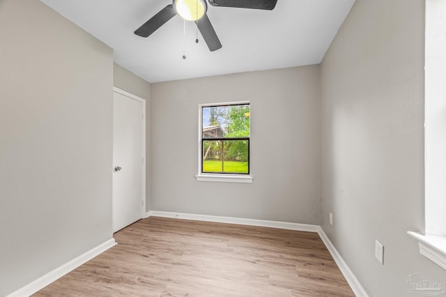 4905 State St, Pensacola, FL 32506 - empty room featuring light wood-style floors, a ceiling fan, and baseboards