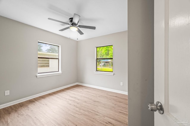 4905 State St, Pensacola, FL 32506 - unfurnished room featuring wood finished floors, baseboards, and a ceiling fan