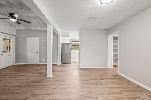 4905 State St, Pensacola, FL 32506 - unfurnished living room featuring light wood-style flooring, a ceiling fan, and baseboards
