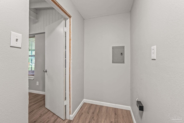 4905 State St, Pensacola, FL 32506 - hall featuring wood finished floors, electric panel, baseboards, and a textured wall