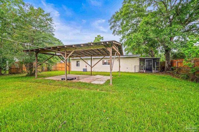 4905 State St, Pensacola, FL 32506 - view of yard featuring a pergola, a patio area, and a sunroom