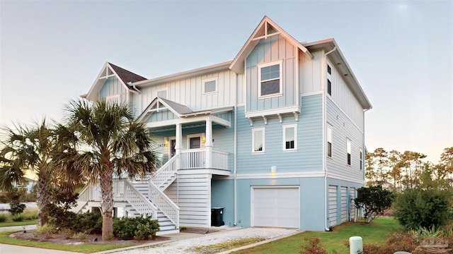 view of front of property featuring a porch and a garage