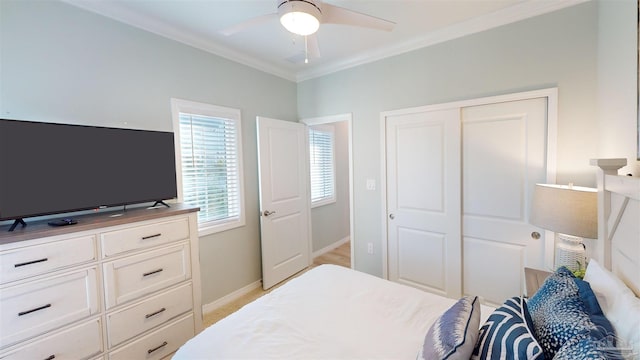 bedroom with light carpet, a closet, ceiling fan, and ornamental molding