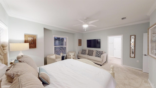 carpeted bedroom featuring ceiling fan and crown molding