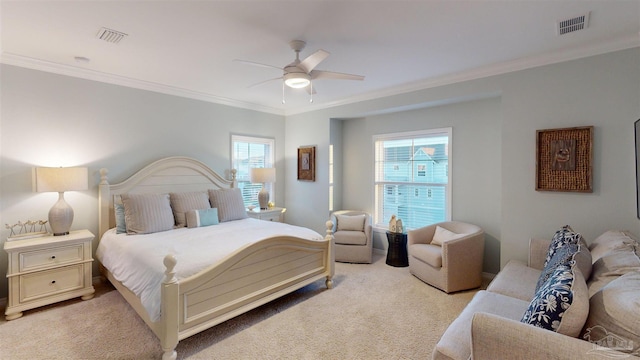 bedroom with ceiling fan, ornamental molding, and light carpet