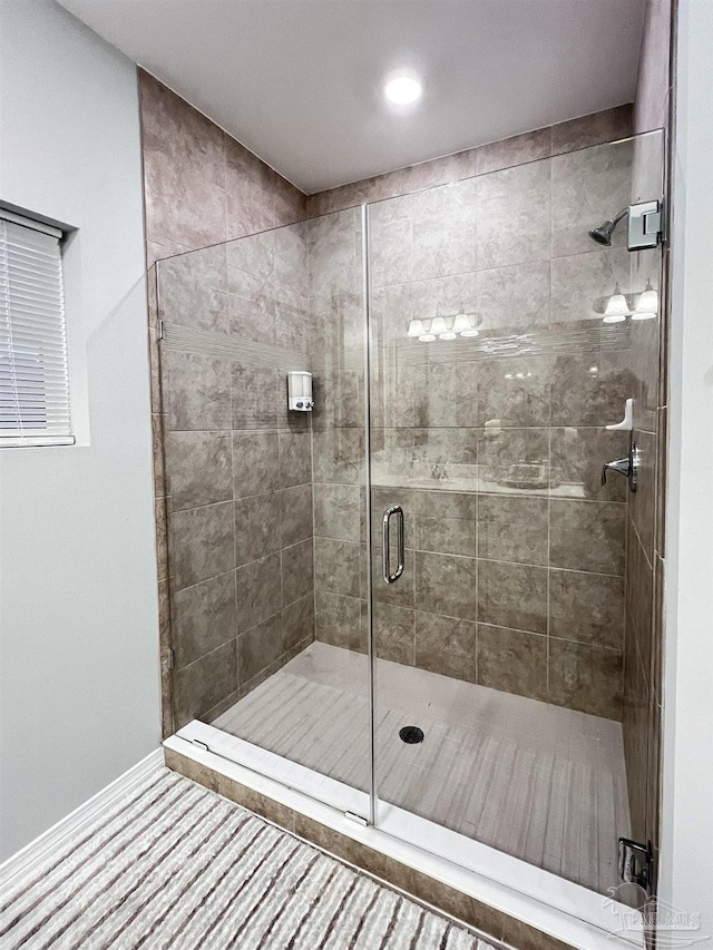 bathroom featuring an enclosed shower