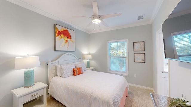 carpeted bedroom featuring ceiling fan and ornamental molding