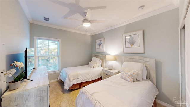 bedroom with light colored carpet, ceiling fan, and crown molding