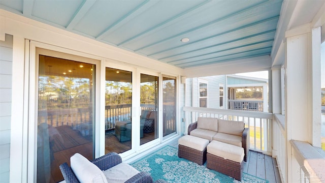 sunroom / solarium with beam ceiling and plenty of natural light