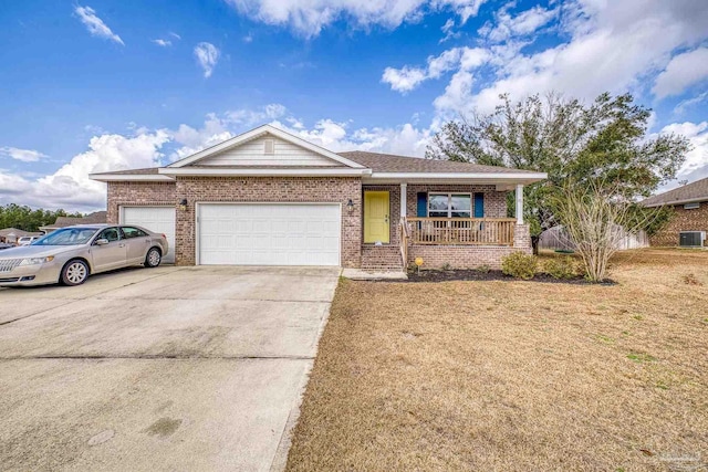 ranch-style house with a porch, a garage, and a front yard