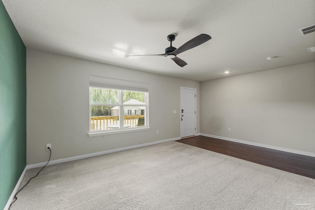 empty room with carpet floors and ceiling fan