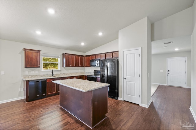 kitchen featuring sink, vaulted ceiling, dark hardwood / wood-style flooring, a kitchen island, and black appliances