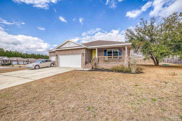 single story home featuring a garage, a porch, and a front yard