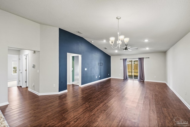 unfurnished living room with lofted ceiling, ceiling fan with notable chandelier, and dark hardwood / wood-style flooring