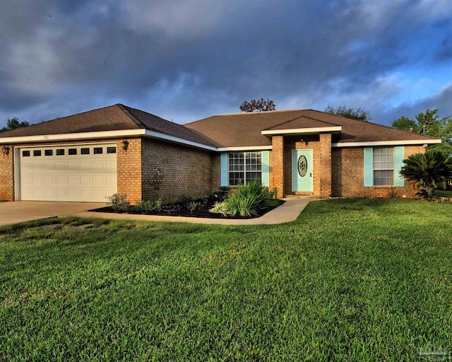 ranch-style house featuring driveway, a front yard, a garage, and brick siding