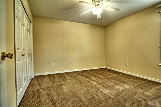 unfurnished bedroom featuring carpet, a closet, ceiling fan, and baseboards