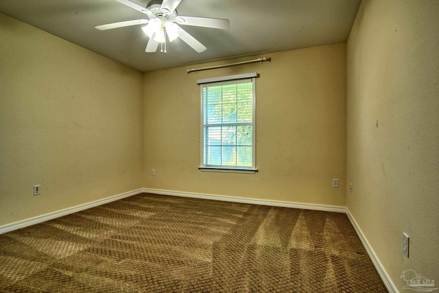 empty room featuring ceiling fan, carpet, and baseboards