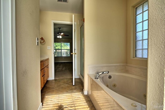 full bathroom featuring a stall shower, visible vents, tile patterned floors, a whirlpool tub, and vanity