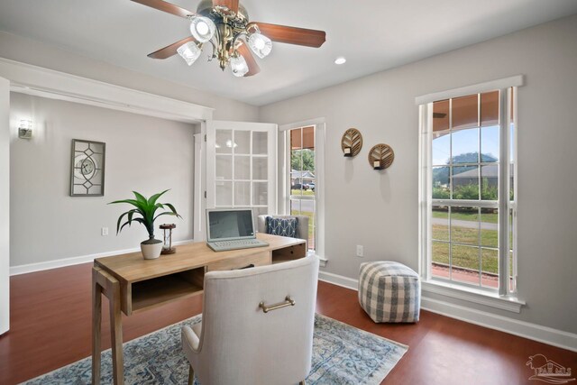 spare room featuring an inviting chandelier and dark wood-type flooring