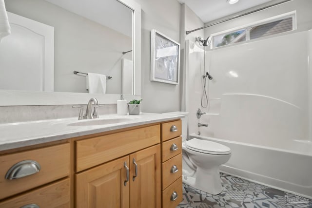 full bathroom with tile patterned flooring, vanity,  shower combination, and toilet