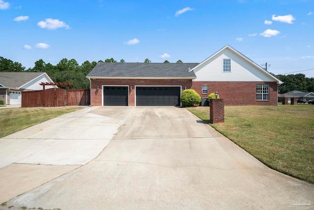 view of front facade with a garage and a front lawn