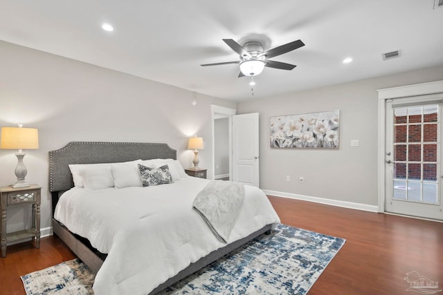 bedroom with ceiling fan and dark hardwood / wood-style flooring