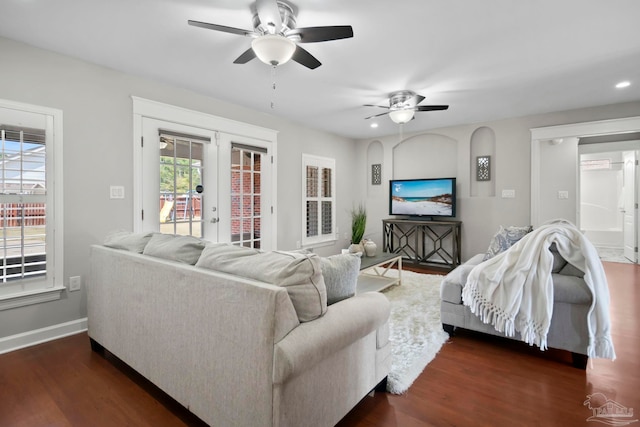 living room with ceiling fan, french doors, and dark hardwood / wood-style floors