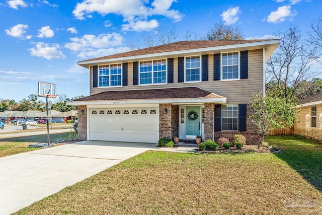 view of front of home with a front yard and a garage