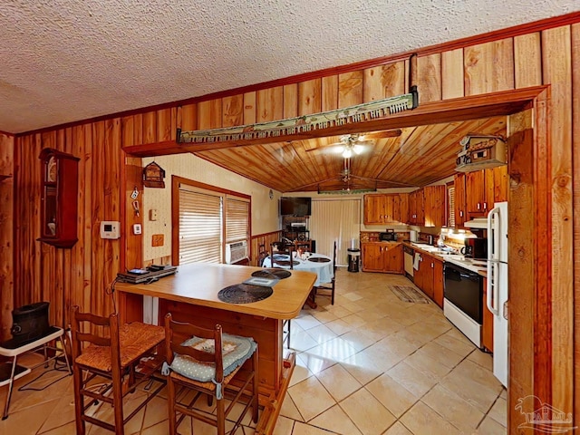 kitchen with ventilation hood, ceiling fan, white range with electric stovetop, and wooden walls