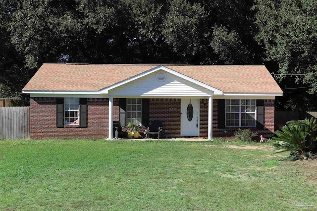 single story home with a front lawn