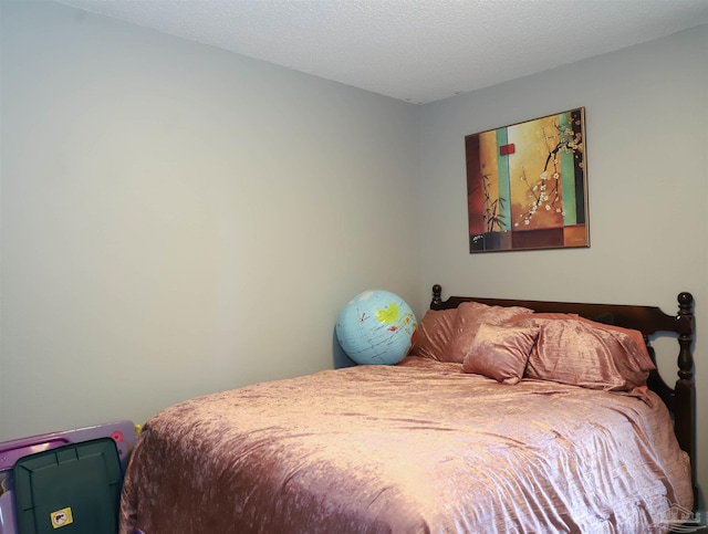 bedroom featuring a textured ceiling