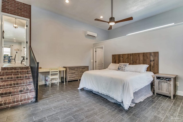 bedroom featuring dark hardwood / wood-style flooring, a wall unit AC, and ceiling fan