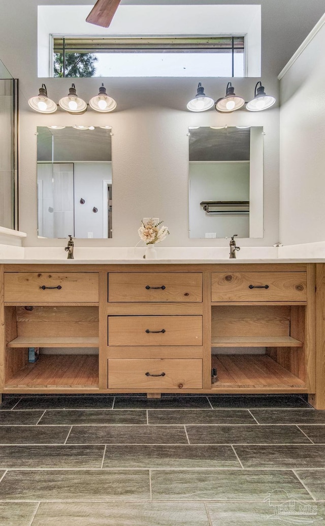 2685 Segrest Rd, Pace, FL 32571 - bathroom with vanity, wood tiled floors, and ornamental molding