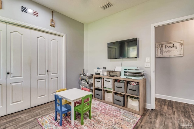 recreation room featuring hardwood / wood-style flooring