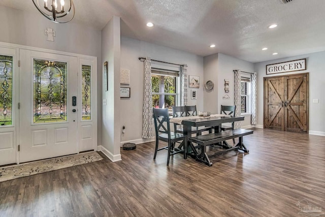 2685 Segrest Rd, Pace, FL 32571 - dining room featuring a chandelier, wood finished floors, baseboards, recessed lighting, and a textured ceiling
