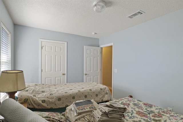 bedroom with a textured ceiling