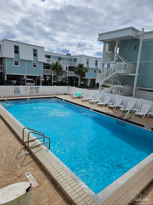 view of swimming pool with a patio