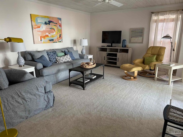 living room with ceiling fan, carpet floors, and ornamental molding