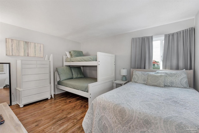 bedroom with hardwood / wood-style floors